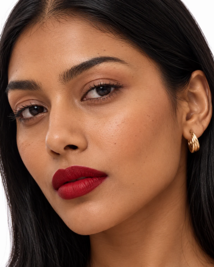Model wearing a Kiro red lip